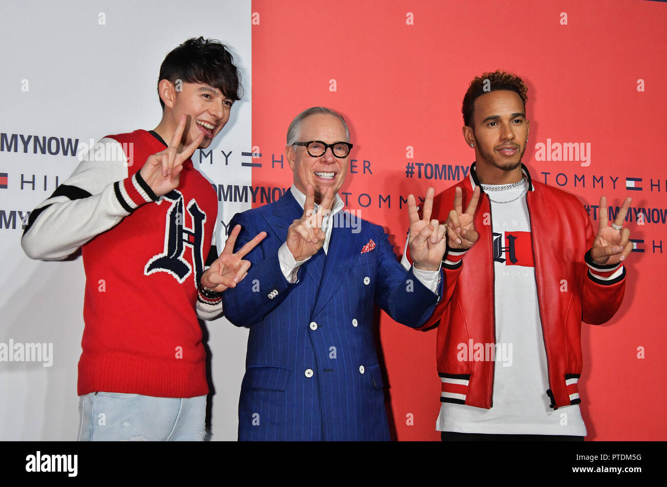 L-R)Model Harry Sugiyama, fashion designer Tommy Hilfiger and racing driver  Lewis Hamilton attend the event "Tommy Hilfiger Presents Tokyo Icons" at  the Tokyo Prince Hotel in Japan on October 8, 2018 Stock