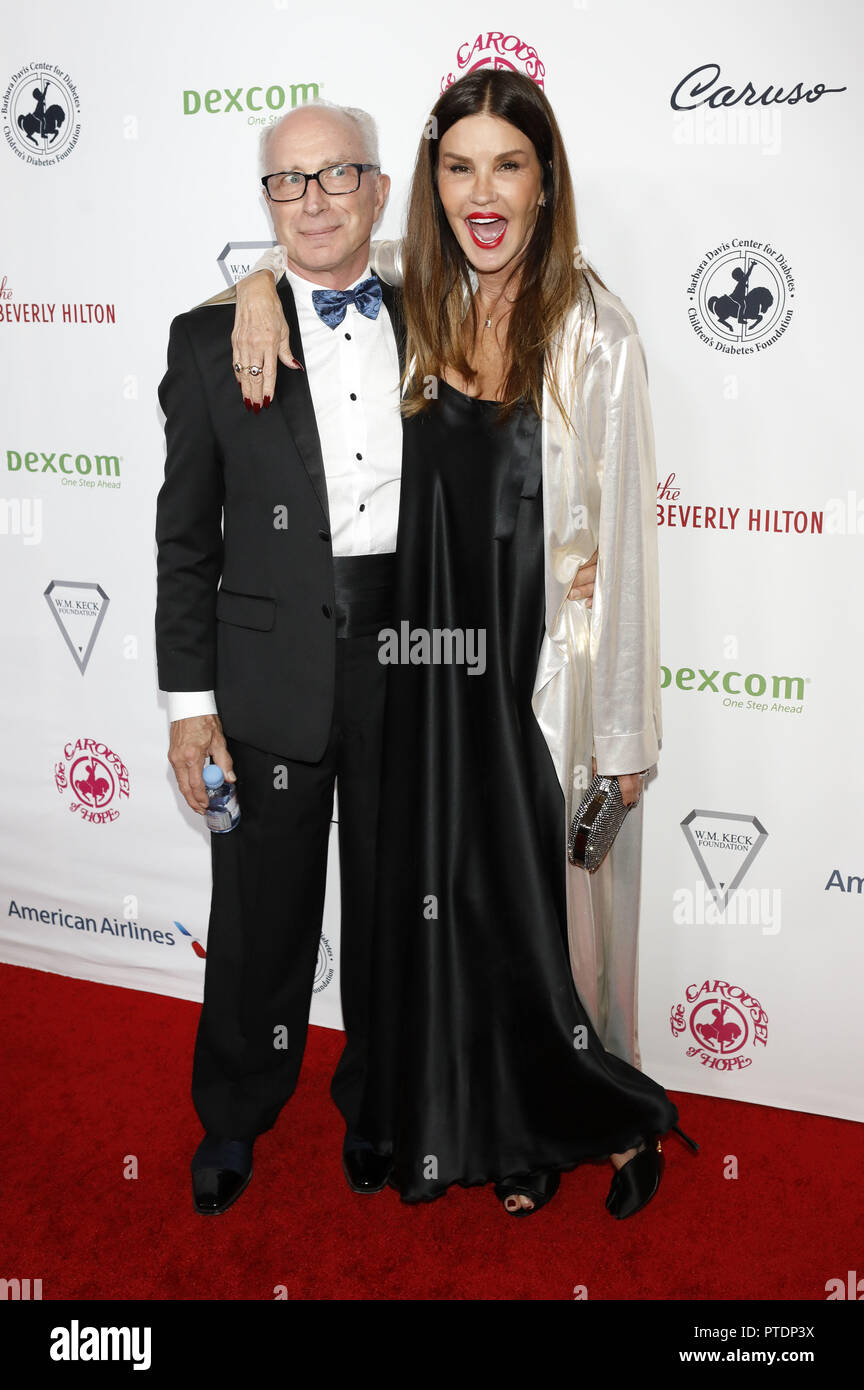 Robert Gerner and his wife Janice Dickinson attending the Carousel of