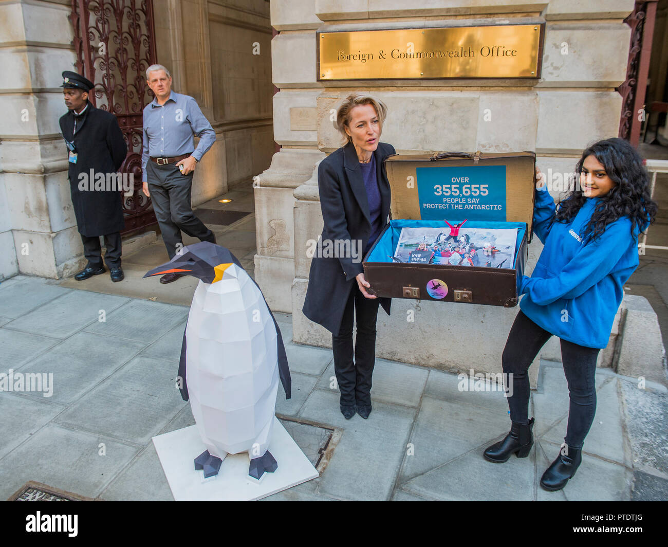 London, UK. 9th October, 2018. Gillian Anderson (pictured) arrives with the 350k signature petition in a well-travelled suitcase - as a Greenpeace Antarctic Ambassador she visits the Foreign & Commonwealth Office to deliver a petition calling for the creation of the largest protected area on Earth – a 1.8 million square kilometre Antarctic Ocean Sanctuary. Credit: Guy Bell/Alamy Live News Stock Photo