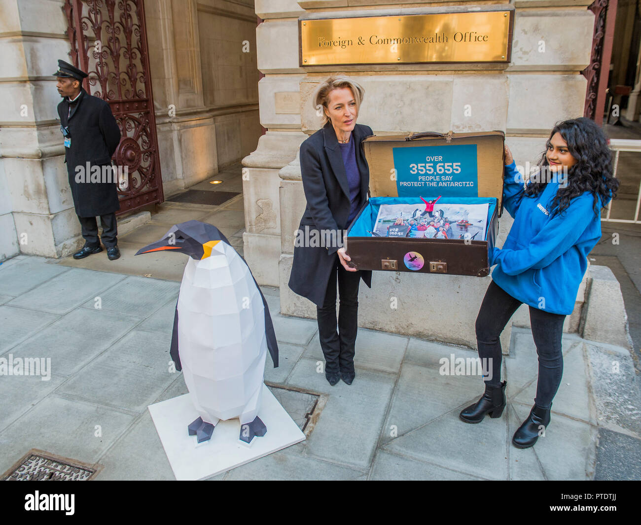 London, UK. 9th October, 2018. Gillian Anderson (pictured) arrives with the 350k signature petition in a well-travelled suitcase - as a Greenpeace Antarctic Ambassador she visits the Foreign & Commonwealth Office to deliver a petition calling for the creation of the largest protected area on Earth – a 1.8 million square kilometre Antarctic Ocean Sanctuary. Credit: Guy Bell/Alamy Live News Stock Photo