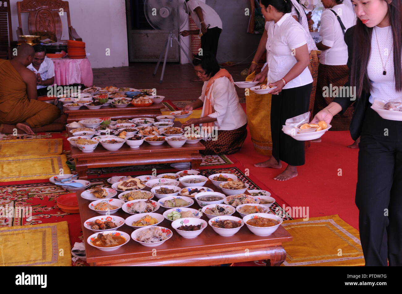 Kandal province, Cambodia. October 9th, 2018. Cambodian women lay out Khmer food for Buddhist monks at a temple during the Pchum Ben festival, also known as 'Ancestors' Day'. Credit: Kraig Lieb / Alamy Live News Stock Photo