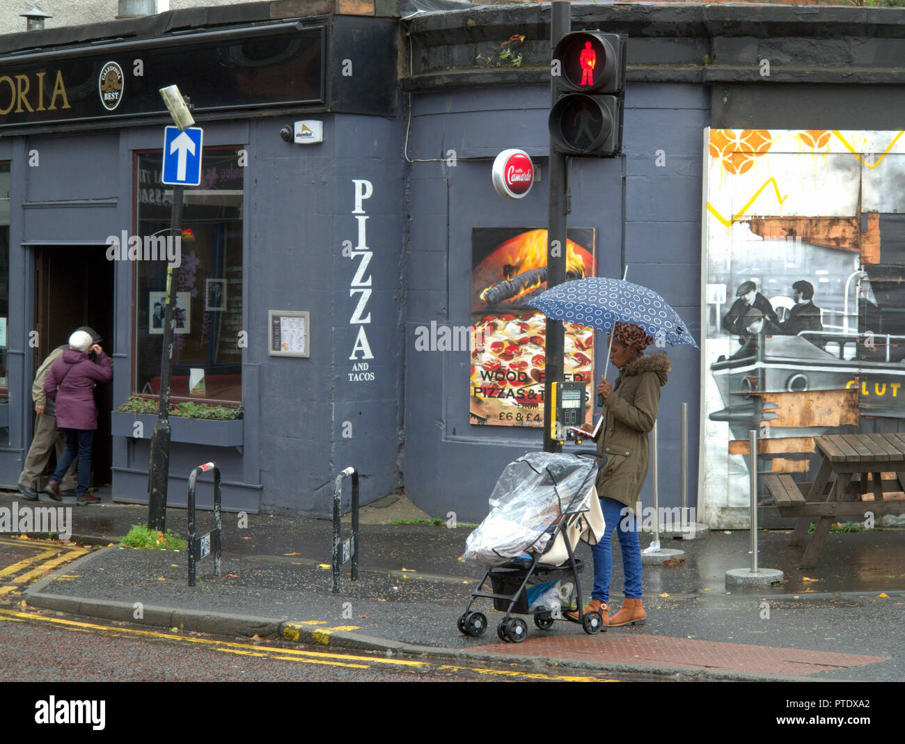 Glasgow, Scotland, UK, 9th October, 2018. UK Weather: Rain and wind over the last few days have taken their toll on the famous mural of the Clutha bar helicopter tragedy scene with parts of the Stan Laurel portrait suffering from the windy wet weather.The famous people depicted have a connection directly with the bar or city. Gerard Ferry/Alamy news Credit: gerard ferry/Alamy Live News Stock Photo