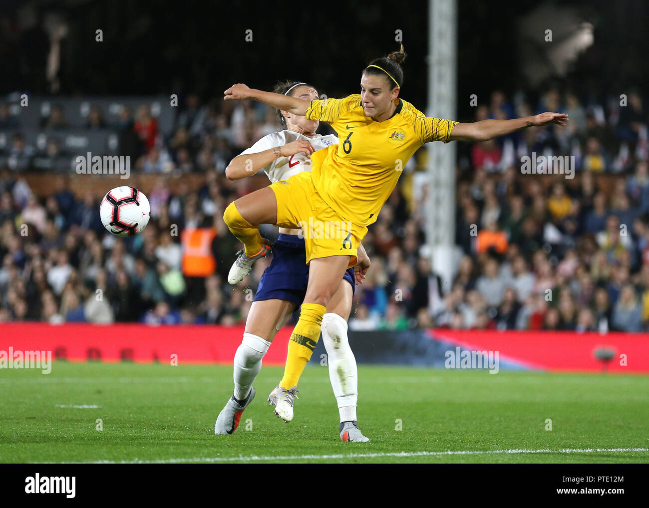 Craven Cottage, London, UK. 9th Oct, 2018. Womens International Football Friendly, England versus Australia; Chloe Logarzo of Australia being challenged by Lucy Bronze of England in the penalty area Credit: Action Plus Sports/Alamy Live News Stock Photo