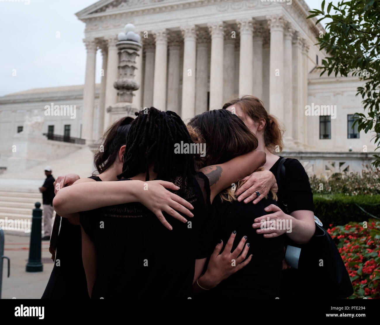 Washington, D.C, USA. 9th Oct, 2018. A group of survivors hug outside of the U.S Supreme Court shortly after Judge KAVANAUGH'S confirmation was announced on October 6, 2018. Credit: Michael A. McCoy/ZUMA Wire/Alamy Live News Stock Photo