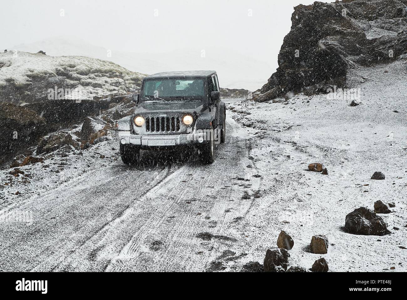 Jeep Wrangler on Icelandic terrain with snow Stock Photo