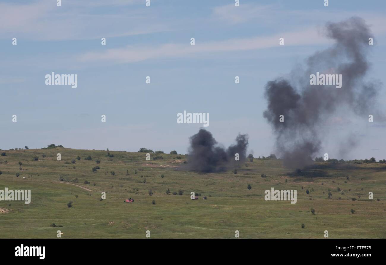 U.S. Soldiers assigned to the 10th Mountain Combat Aviation Brigade, position their AH-64 Apaches in an attack by fire position during a rehearsal for the combined arms live fire exercise portion of Getica Saber, July 14, 2017 at the Joint National Training Center in Cincu, Romania.  Getica Saber 17 is a U.S.-led fire support coordination exercise and combined arms live fire exercise that incorporates six Allied and partner nations with more than 4,000 Soldiers.  Getica Saber 17 runs concurrent with Saber Guardian 17, a U.S. European Command, U.S. Army Europe-led, multinational exercise that s Stock Photo