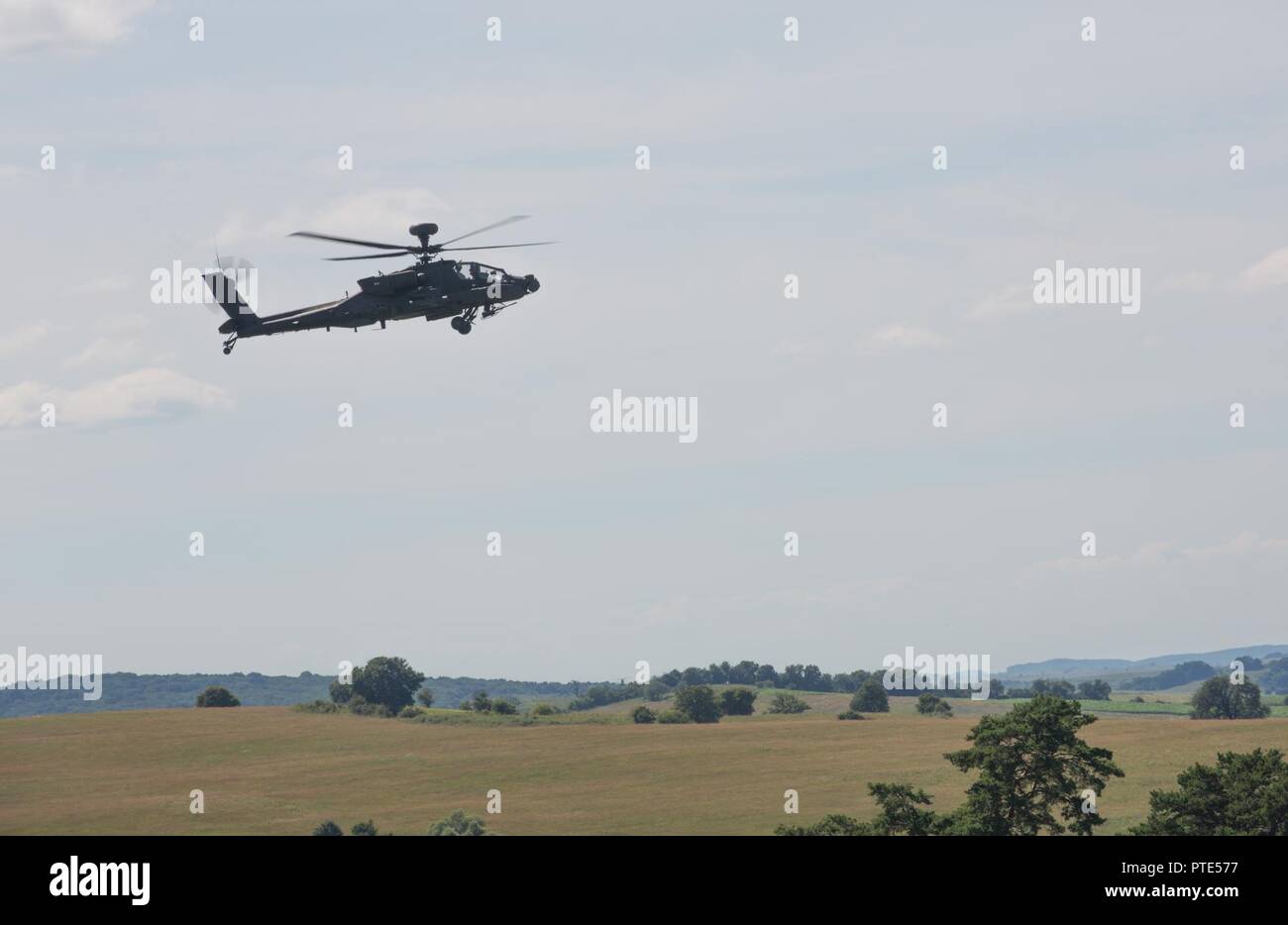 U.S. Soldiers assigned to the 10th Mountain Combat Aviation Brigade, position their AH-64 Apaches in an attack by fire position during a rehearsal for the combined arms live fire exercise portion of Getica Saber, July 14, 2017 at the Joint National Training Center in Cincu, Romania.  Getica Saber 17 is a U.S.-led fire support coordination exercise and combined arms live fire exercise that incorporates six Allied and partner nations with more than 4,000 Soldiers.  Getica Saber 17 runs concurrent with Saber Guardian 17, a U.S. European Command, U.S. Army Europe-led, multinational exercise that s Stock Photo