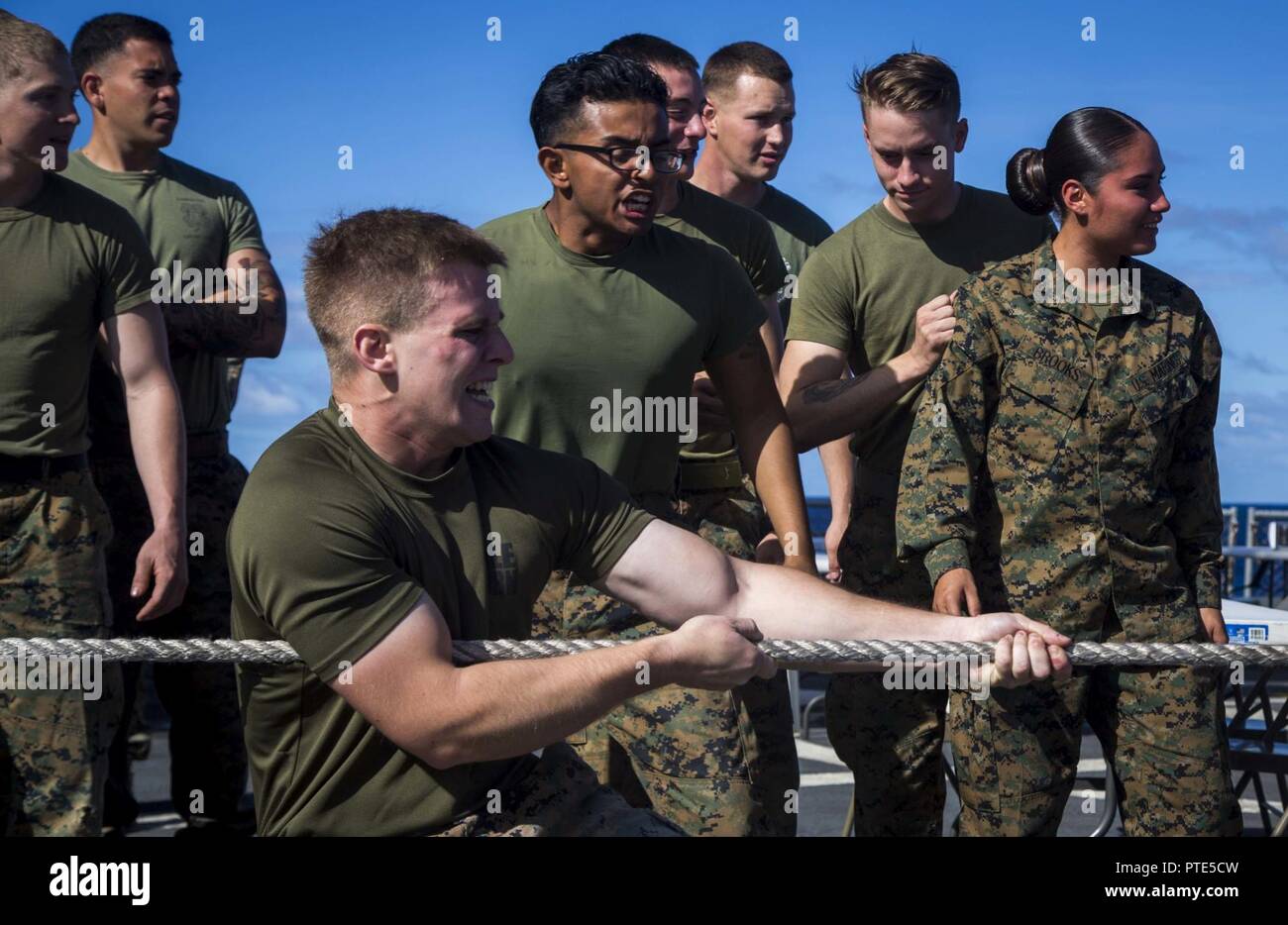 U.S. Marine Corps Cpl. Raymond Miller with Task Force Koa Moana 17, participates in a game of Tug-of-War against French soldiers in celebration for Bastille Day aboard the USNS Sacagawea on July 14, 2017. Bastille Day is recognized as the day the French gained their freedom from King Louis XVI by liberating prisoners from the Bastille Prison in 1789 and are now celebrating their 228thyear as a free nation. Stock Photo