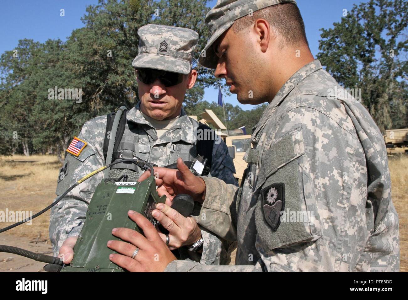 Spc. Dean Stubblefield, right, a signal support systems specialist with