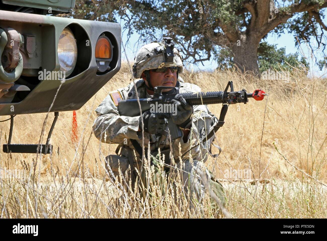 sgt-nestor-morales-a-chemical-biological-radiological-nuclear-cbrn-specialist-with-the-149-cbrn-company-49th-military-police-brigade-california-army-national-guard-pulls-security-while-his-unit-s-convoy-is-stopped-on