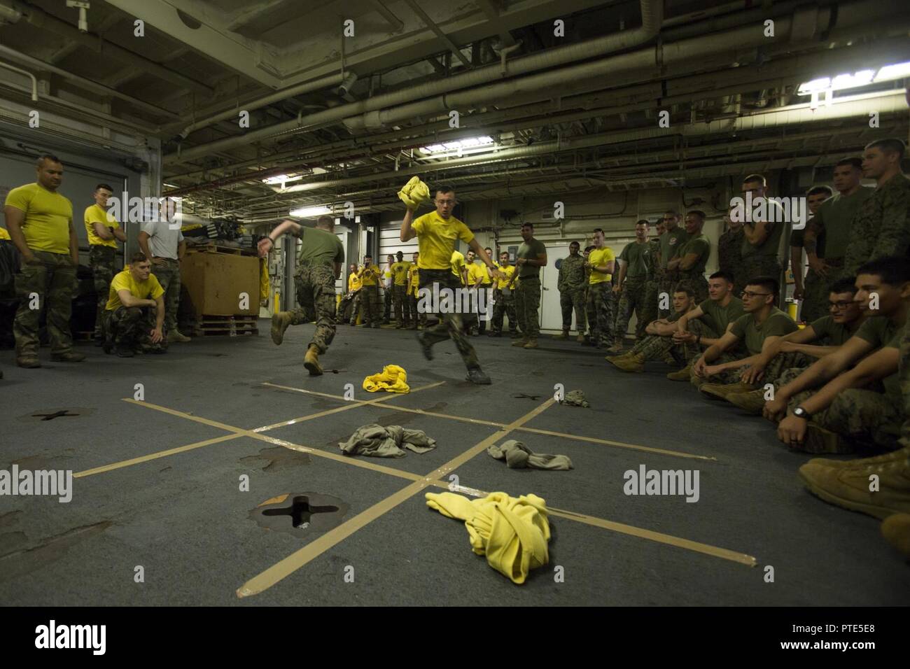 USNS SACAGAWEA— Marines and sailors with Task Force Koa Moana 17 compete in a game of relay tic-tac-toe against French soldiers in celebration of Bastille Day July 14 aboard the USNS SACAGAWEA. Bastille Day is recognized as the day the French gained their independence from King Louis XVI by liberating prisoners from the Bastille Prison in 1789 and are now celebrating their 228th year as a free nation. Stock Photo