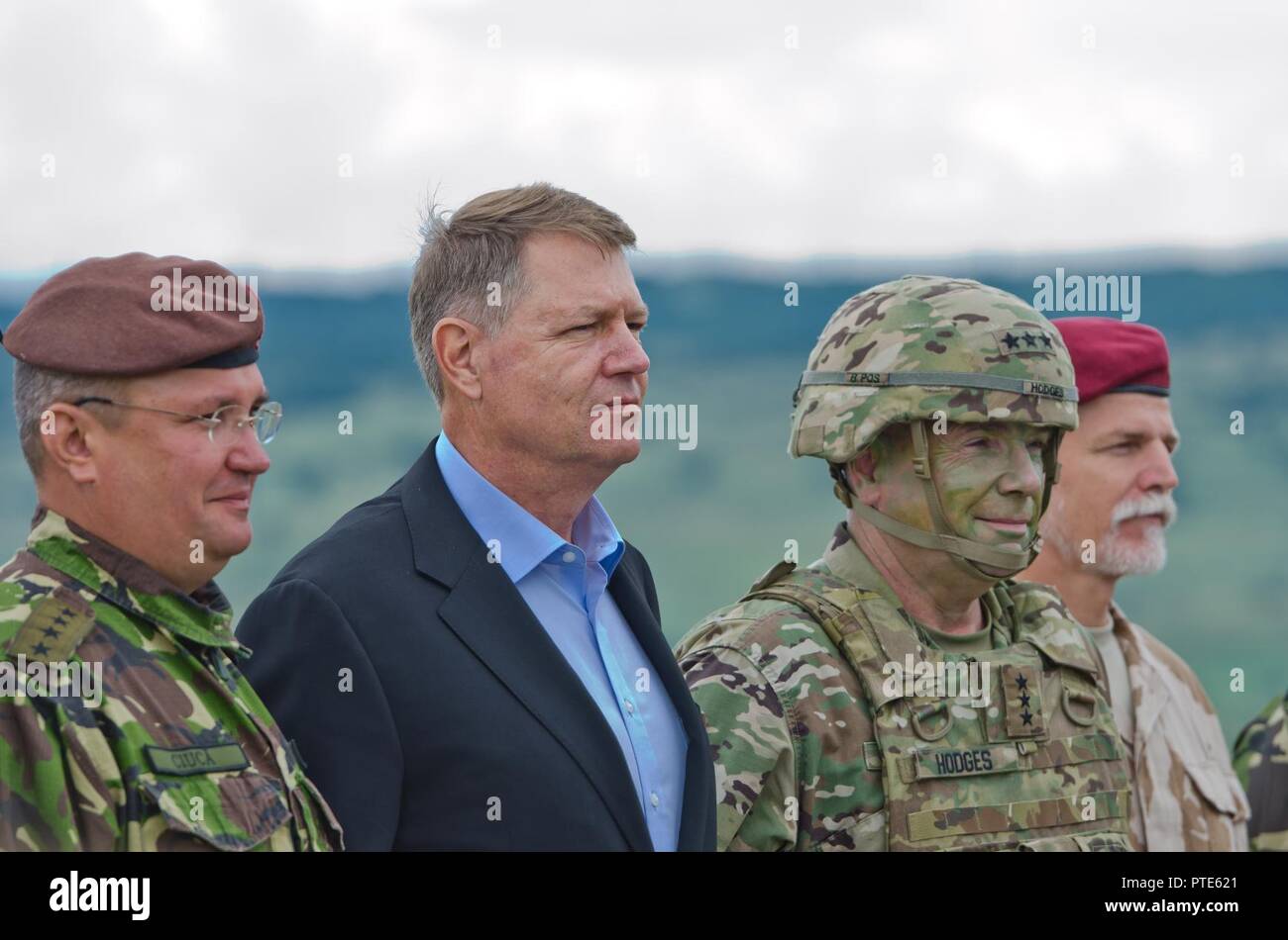 Romania President Klaus Iohannis stands next to U.S. Army Lt. Gen. Ben Hodges during the Distinguished Visitors Day for Getica Saber at the Joint National Training Center in Cincu, Romania, July 15, 2017. Getica Saber 17 is a U.S.-led fire support coordination exercise and combined arms live fire exercise that incorporates six Allied and partner nations with more than 4,000 Soldiers. Getica Saber 17 runs concurrent with Saber Guardian 17, a U.S. European Command, U.S. Army Europe-led multinational exercise that spans across Bulgaria, Hungary and Romania with more than 25,000 service members fr Stock Photo