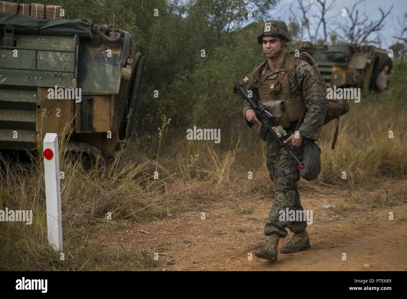 Lance Cpl. Andrew P. Carrera, a mortar man with Weapons Platoon, India Company, Battalion Landing Team, 3rd Battalion, 5th Marines, 31st Marine Expeditionary Unit, patrols through the Australia Defense Force’s Townshend Island Training Area, Queensland, Australia, during Exercise Talisman Saber 17, July 14, 2017. The company’s simulated mission included clearing and securing the training area. India Company is the mechanized raid company for the 31st MEU, currently supporting Talisman Saber 17 while deployed on its scheduled patrol of the Indo-Asia-Pacific region. Talisman Saber is a biennial  Stock Photo