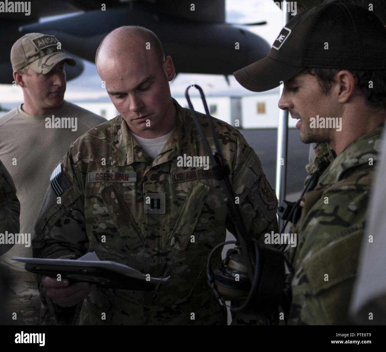 A U.S. Air Force 17th Special Operations Squadron MC-130J Commando II aircraft commander and 320th Special Tactics Squadron jumpmaster discuss the parameters for high altitude, high opening (HAHO) jump operations July 11, 2017, at Rockhampton, Australia during Talisman Saber 2017. Experts in specialized aviation, the 17th SOS executed complex personnel and cargo airdrops, low-level flying operations and dissimilar formation flights with 37th Squadron Royal Australian Air Force and 40th Squadron Royal New Zealand Air Force throughout the exercise. Stock Photo