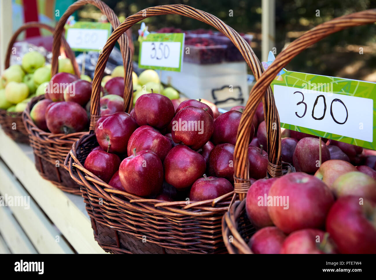 Basket with red apples and price tag on the market in Almaty, Kazakhstan Stock Photo