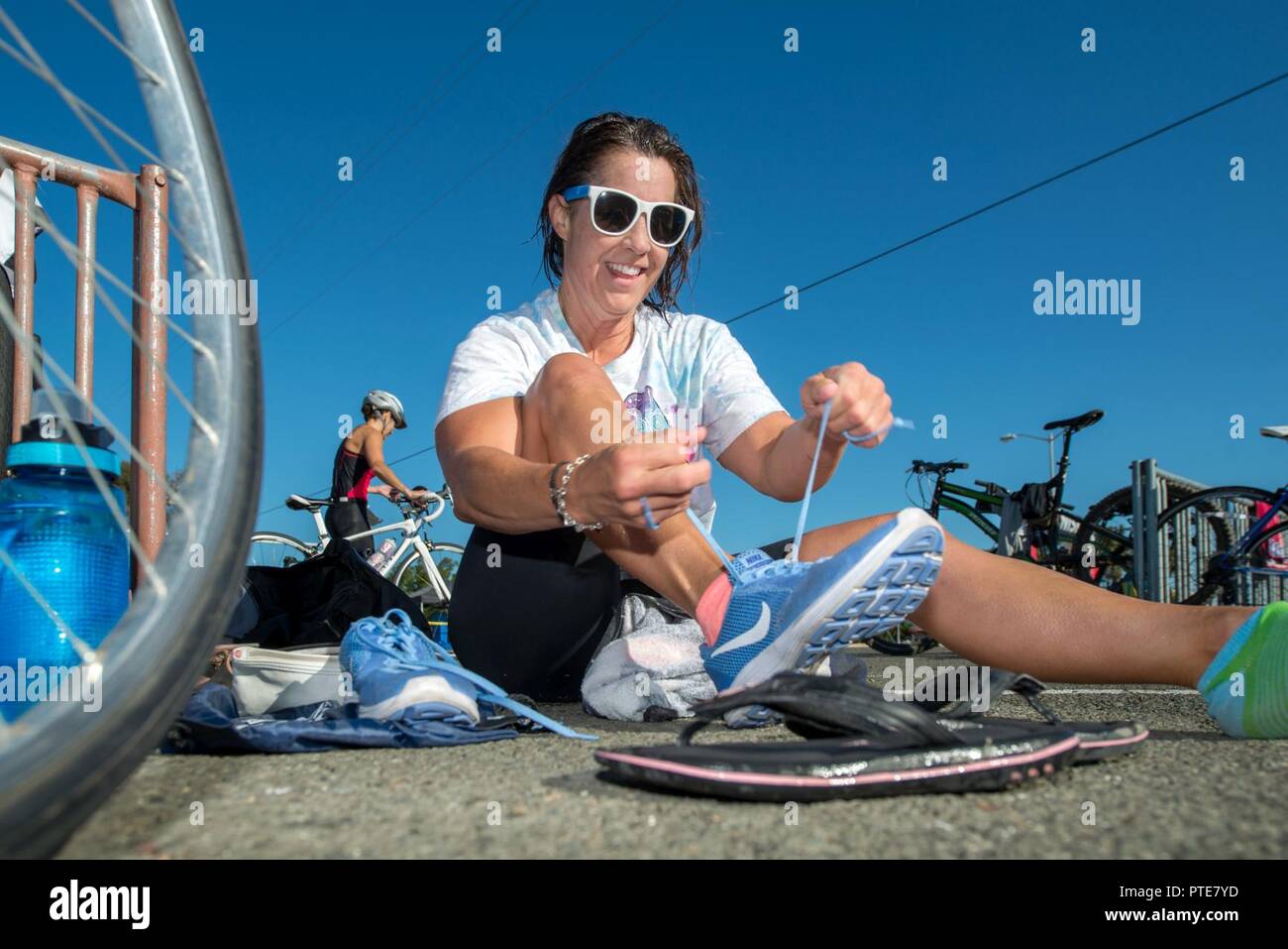 Lori Evalle transitions from the swim to her bike during the Travis