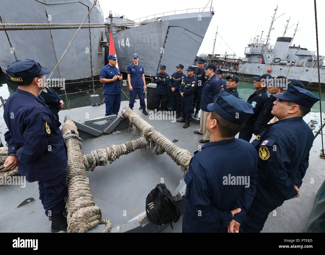 Peru (July 16, 2917) U.S. Coast Guard Lt. Kip Hutchinson, center