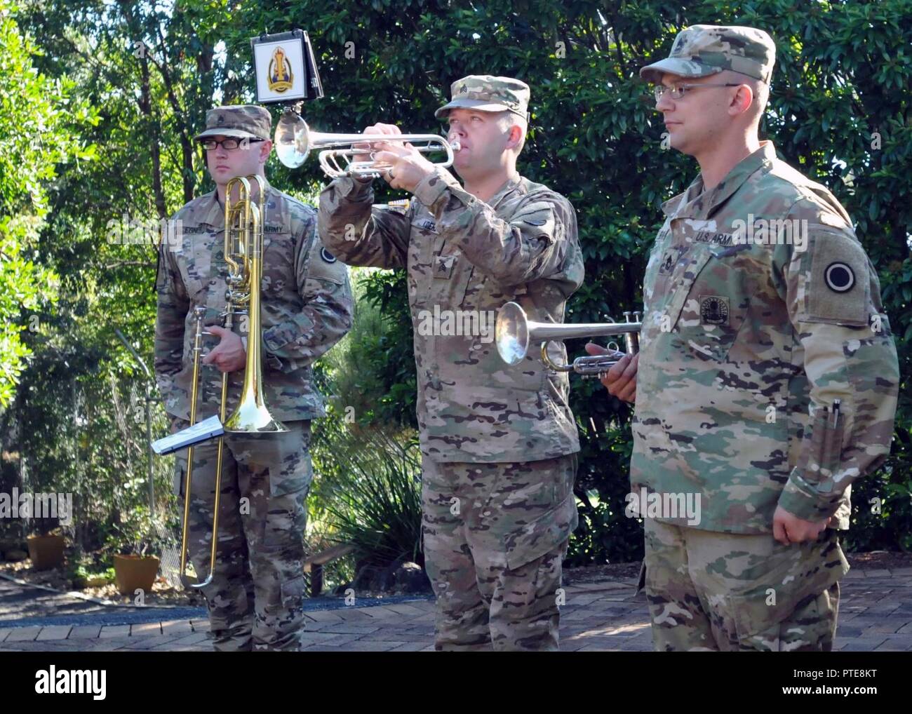Sgt. Mark Koehl, an army musician, American's First Corps Army Band, plays  “Rouse” while Sgt. 1st Class Todd Borges, music performance team leader,  Staff Sgt. Brandon Egner, assistant music performance team leader,