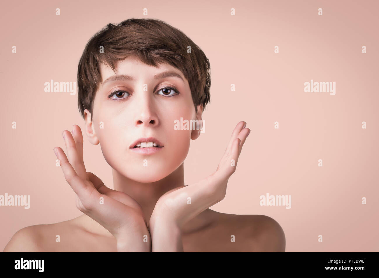 Beautiful female face close up. portrait of young model at studio on ...