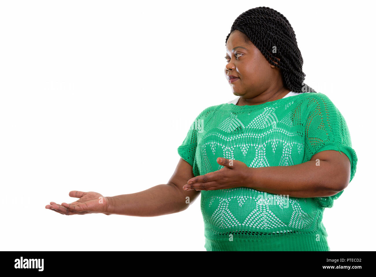 Profile view of fat black African woman showing something  Stock Photo