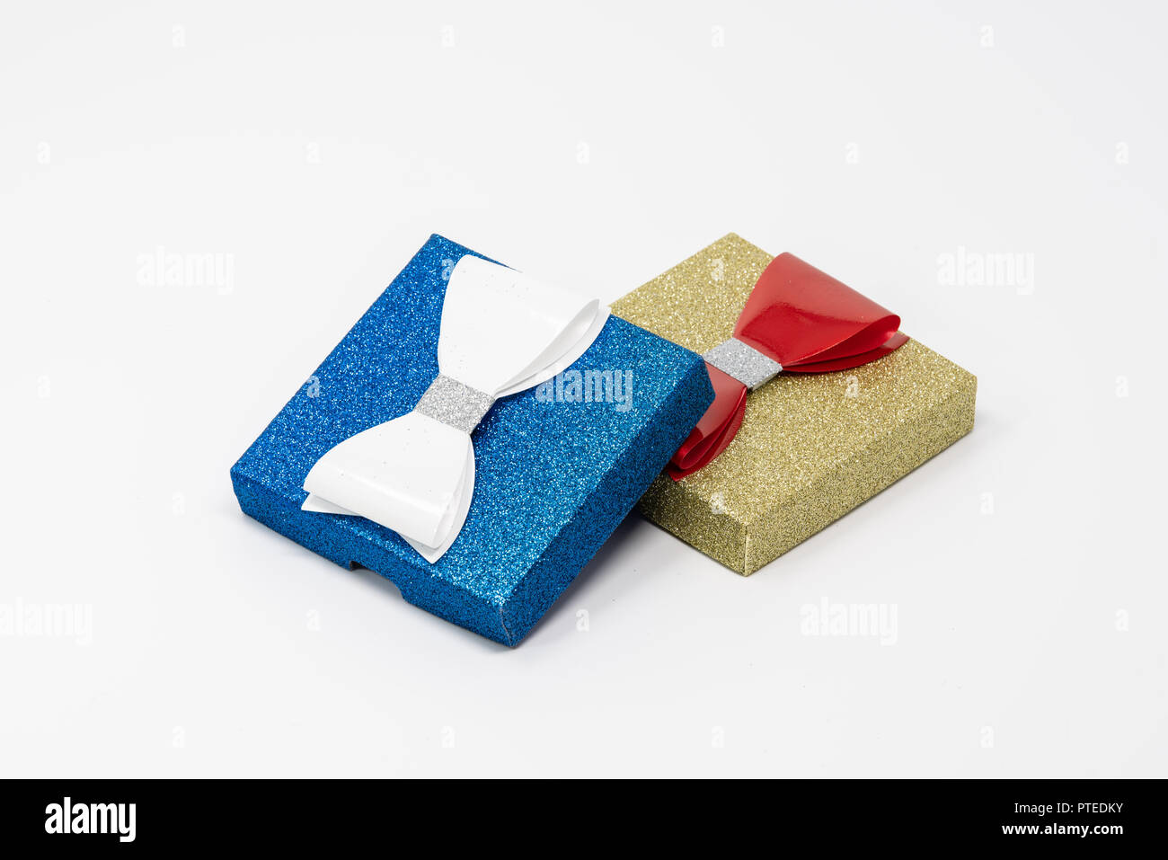 Two present boxes with bows stacked on each other. Stock Photo