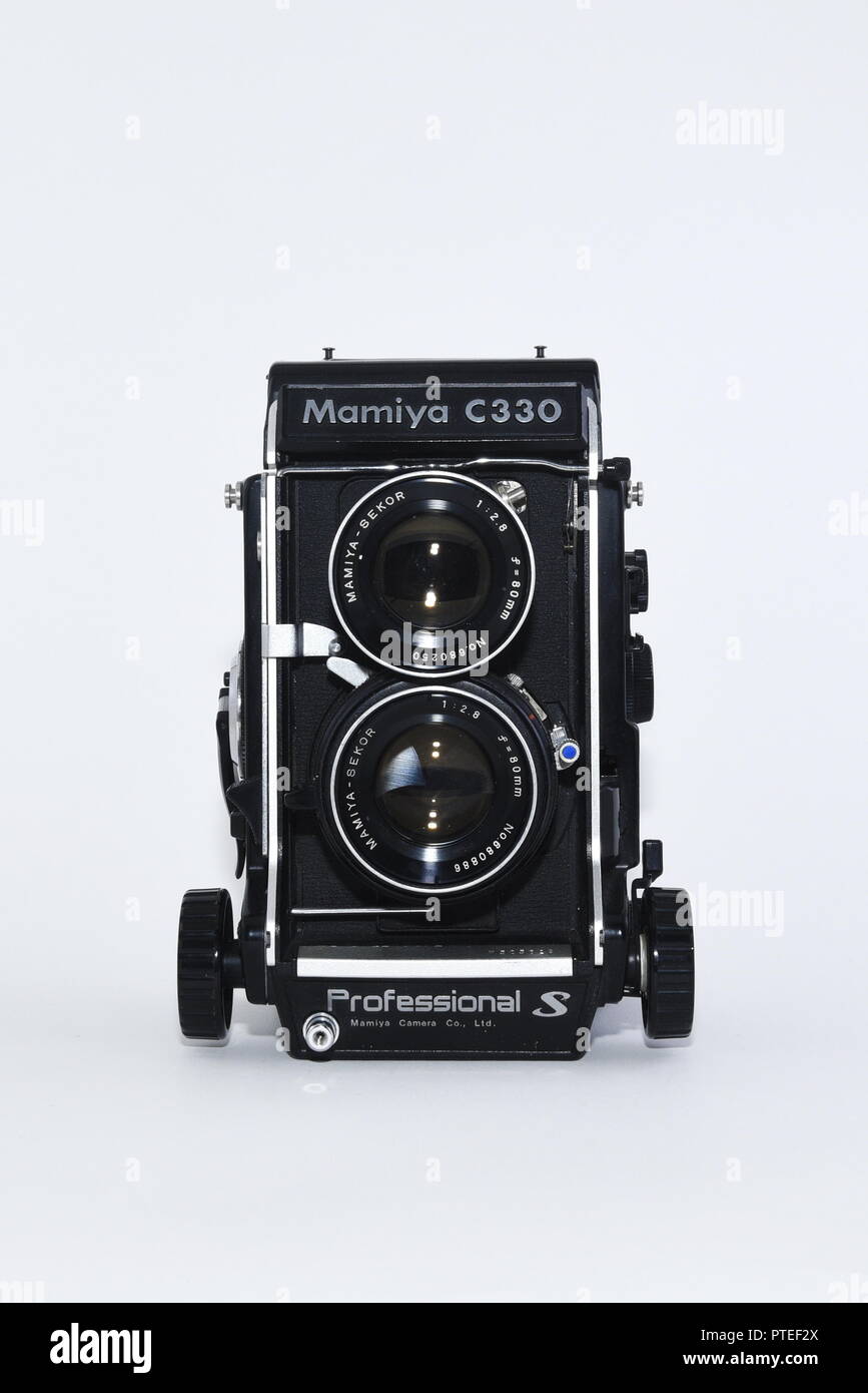 Mamiya C330 professional film Twin Lens Reflex Camera Base produced in the 1980s. Close up of Professional S version straight on against white Stock Photo