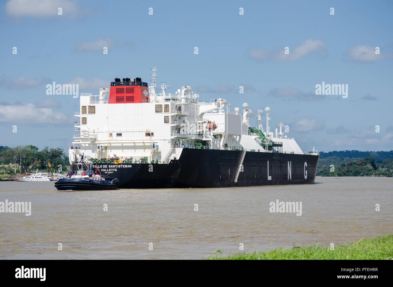 Liquefied natural gas (LNG) vessel transiting through de Panama Canal at the southwestern end of Gatun Lake and the confluence with the Chagres River Stock Photo
