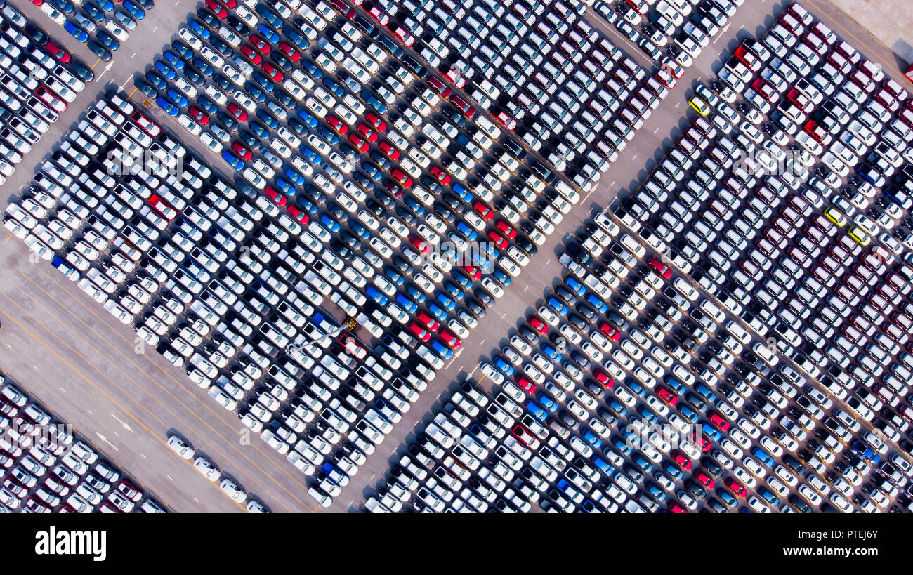 New cars from the car factory parked at the port waiting for export to the country as ordered. Stock Photo