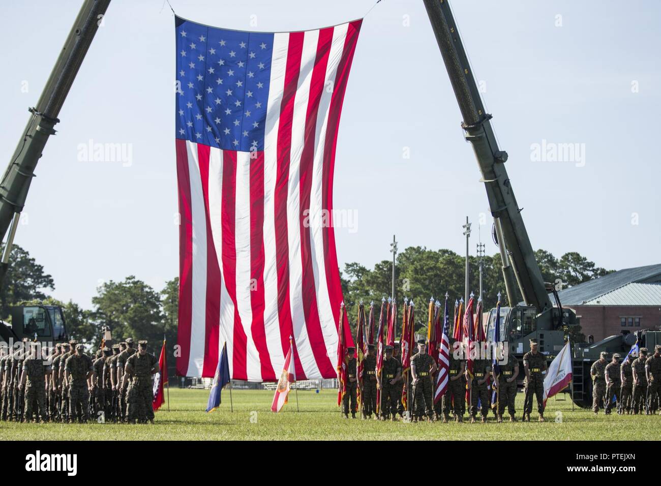 U.S. Marines assigned to II Marine Expeditionary Force (MEF) during the II Marine Expeditionary Force (II MEF) change of command ceremony on Camp Lejeune, N.C., July 14, 2017. During the ceremony, Maj. Gen. Walter L. Miller Jr. relinquished his command as commanding general of II MEF to Lt. Gen. Robert F. Hedelund. Stock Photo