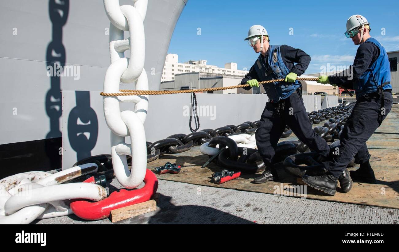 Washington (July 14, 2017) Seaman Dylan Topham, from Santa Maria, California (left), and Seaman Aaron Miller, from Seattle, guide anchor shot onto a detachable link in preparation to reattach USS John C. Stennis' (CVN 74) anchor. John C. Stennis is conducting a planned incremental availability (PIA) at Puget Sound Naval Shipyard and Intermediate Maintenance Facility, during which the ship is undergoing scheduled maintenance and upgrades. Stock Photo