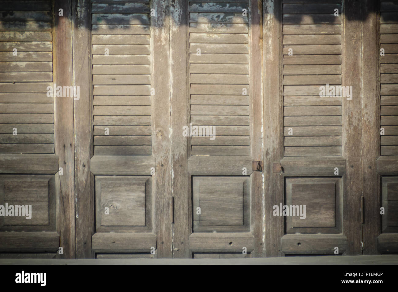 Old ancient wooden swing door background. Vintage of old wooden folding