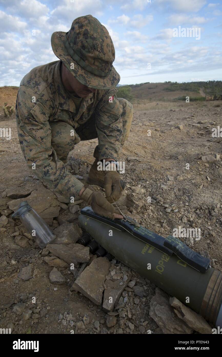 Cpl. Danny Cook prepares a 155-mm artillery round for a controlled detonation as part of an explosives demolition range during Exercise Talisman Saber 17 on Townshend Island, Shoalwater Bay Training Area, Queensland, Australia, July 18, 2017. Cook, a native of Spencer, Tennessee, is a radio operator with Combat Logistics Battalion 31. He enlisted in May 2015 after graduating from Van Buren High School. Marines with CLB-31 provide essential support to the Marines and Sailors of the 31st Marine Expeditionary Unit while supporting Talisman Saber 17. The 31st MEU is taking part in Talisman Saber 1 Stock Photo