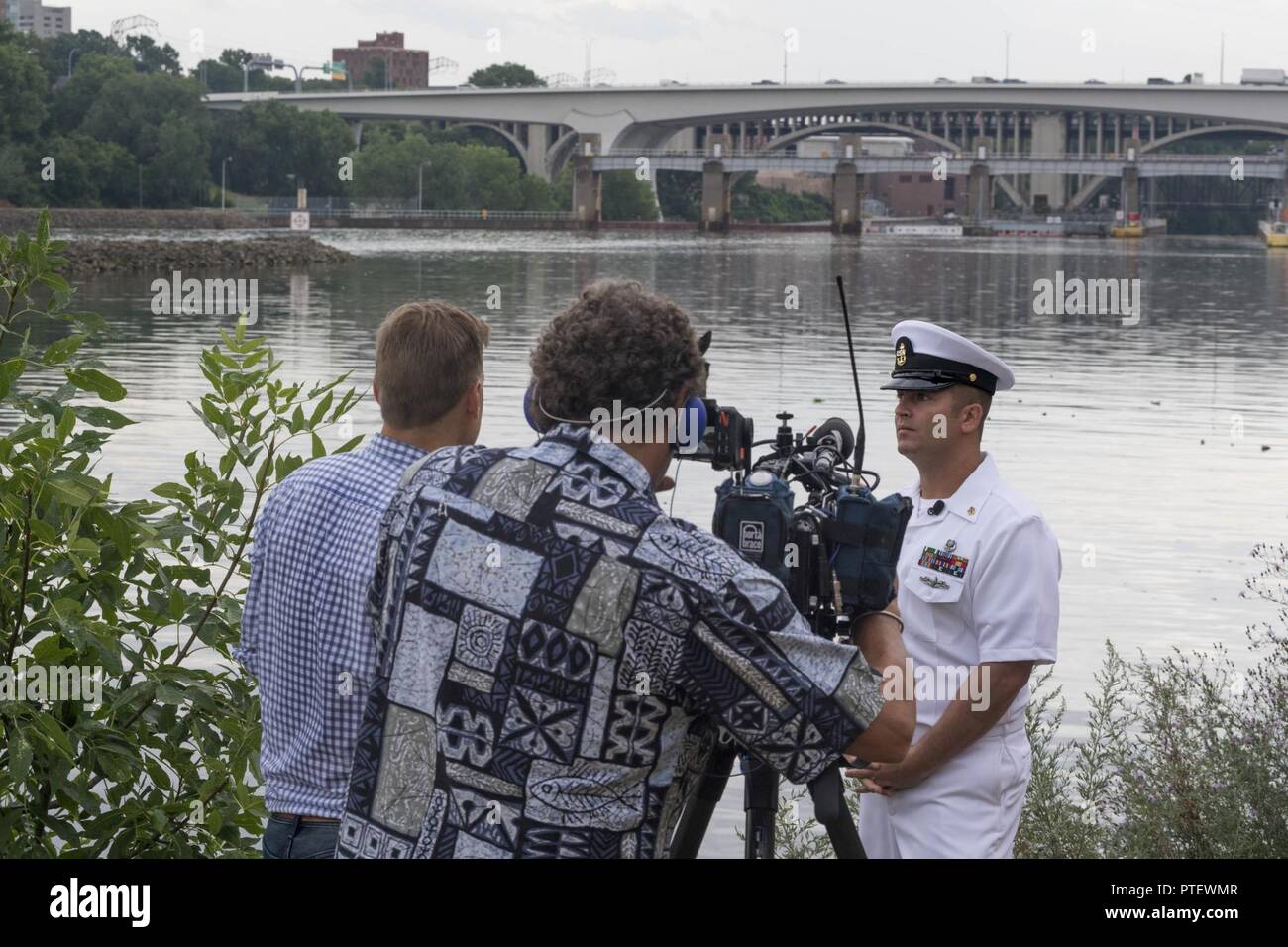 MINNEAPOLIS (July 18, 2017) –Chief Navy Diver Noah Gottesman, a native of Gaithersburg, Md., reflects back to ten years ago when he was called to assist local, state and federal authorities in finding missing victims in the wake of the bridge collapse while he was attached to Mobile Diving and Salvage Unit (MDSU) 2. Gottesman returned to the area for an interview with NBC KARE 11 reporter Kent Erdahl, during Minneapolis/St. Paul Navy Week. Navy Week programs serve as the Navy's principal outreach effort into areas of the country without a significant Navy presence, with 195 Navy Weeks held in  Stock Photo