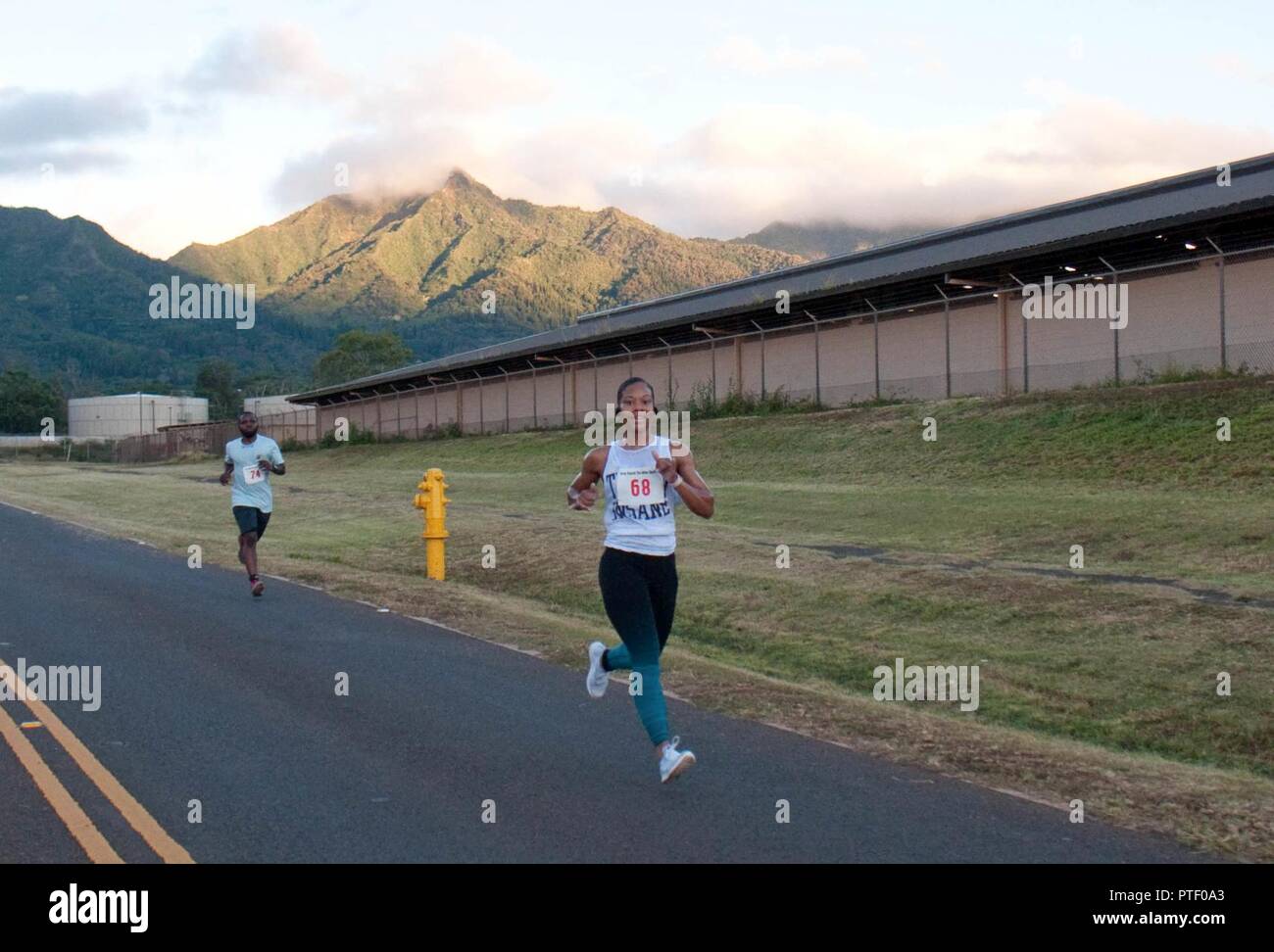 SCHOFIELD BARRACKS — Capt. Milana Taylor (front), a Soldier with 225th  Brigade Support Battalion, and 1st Lt. Idris Usman, a Soldier with the U.S.  Army Health Clinic-Schofield Barracks, run in the ninth