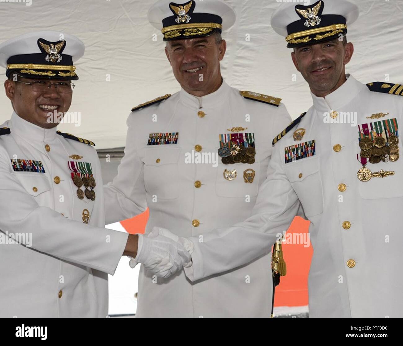 Cmdr. Michael R. Gesele, (right) former commanding officer of the Coast ...