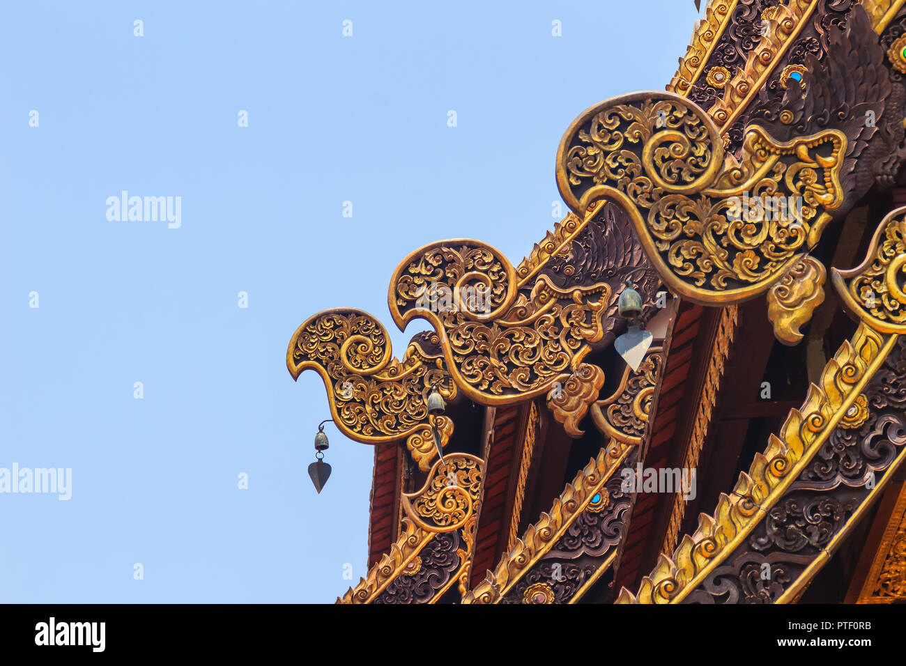 Beautiful craved naga pattern on the rafter and gable of the Thai's ...