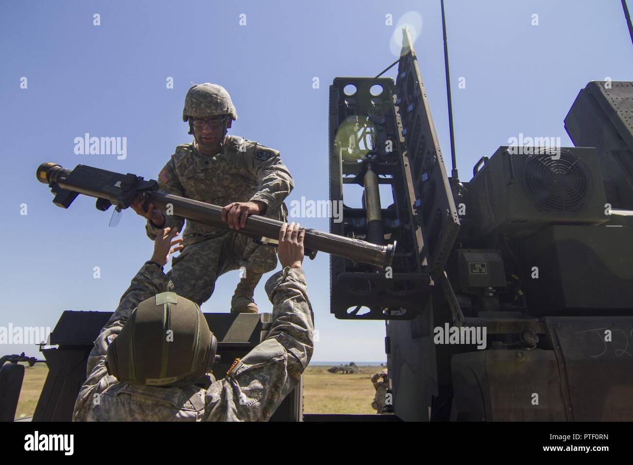 Soldiers with C Battery, 2nd battalion, 263rd Army Air and Missile Defense Command, South Carolina Army National Guard, load Stinger missiles into an AN/TWQ-1 Avenger air defense system before live fire training July 19, 2017, at Capu Midia, Romania, as part of exercise Saber Guardian 17. Saber Guardian is a U.S. Army Europe-led, multinational exercise that spans across Bulgaria, Hungary and Romania with more than 25,000 service members from 22 allied and partner nations. Stock Photo