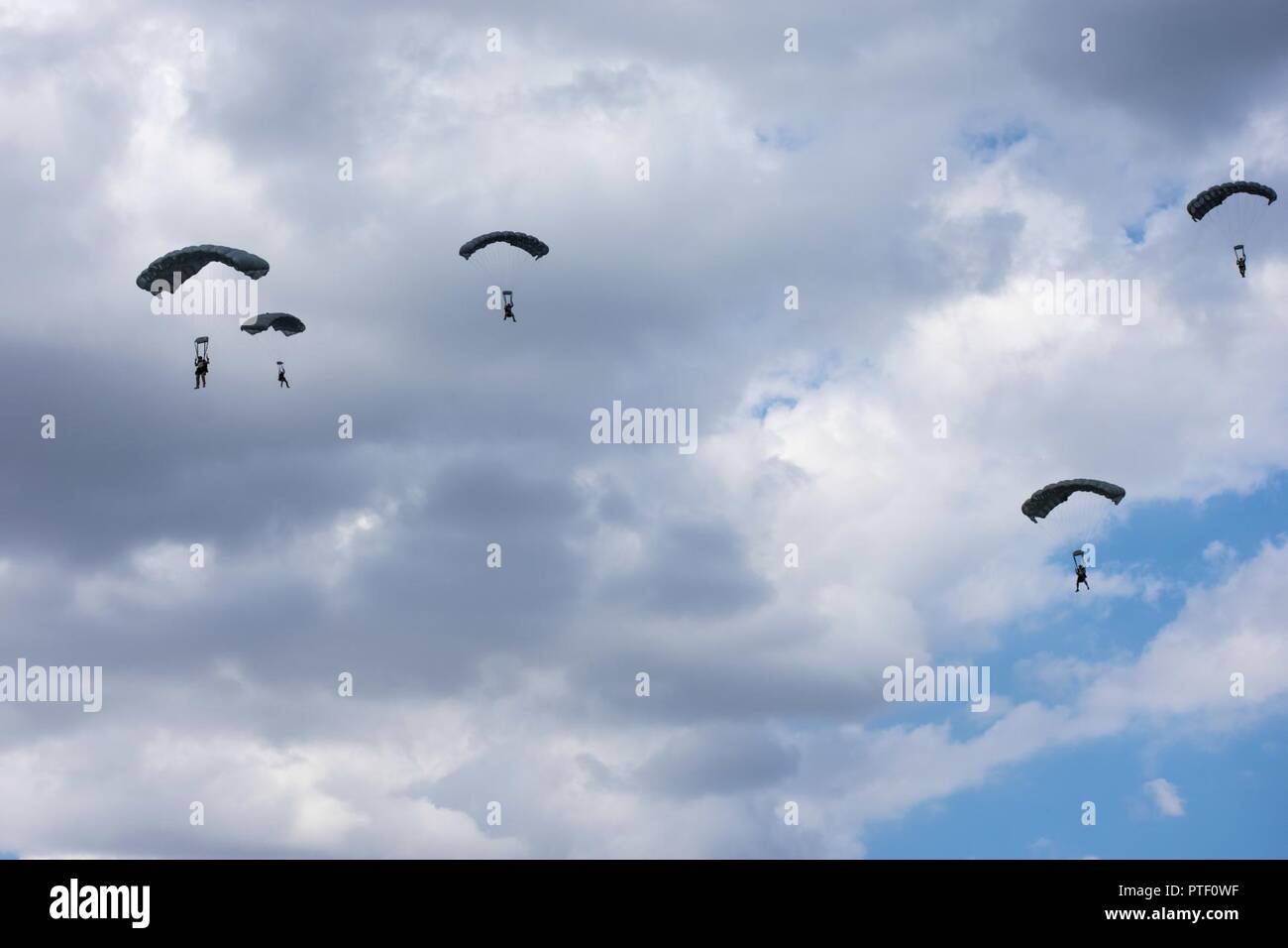 Naval Special Warfare Operators conduct a combined airborne insertion with Ukrainian Special Operation Forces at Ochakiv, Ukraine, July 9, 2017 during Sea Breeze 17.  Sea Breeze is a U.S. and Ukraine co-hosted multinational maritime exercise held in the Black Sea and is designed to enhance interoperability of participating nations and strengthen maritime security within the region. Stock Photo