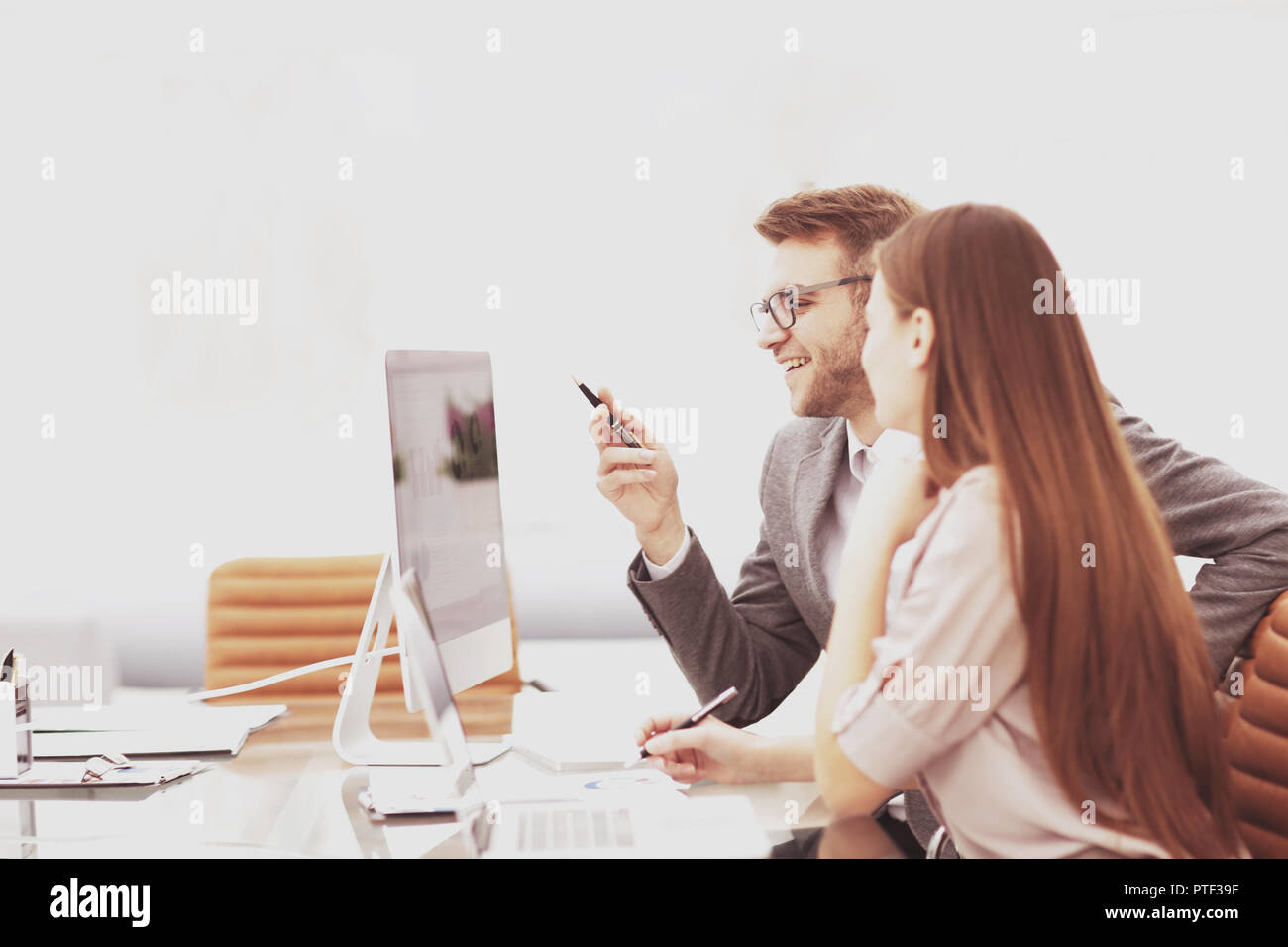 Two managers in a business meeting analyzing data Stock Photo