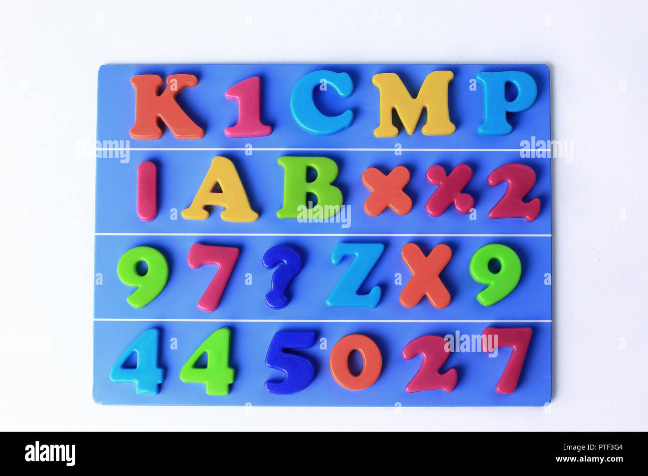 Colored magnetic letters on blue hi-res stock photography and images ...