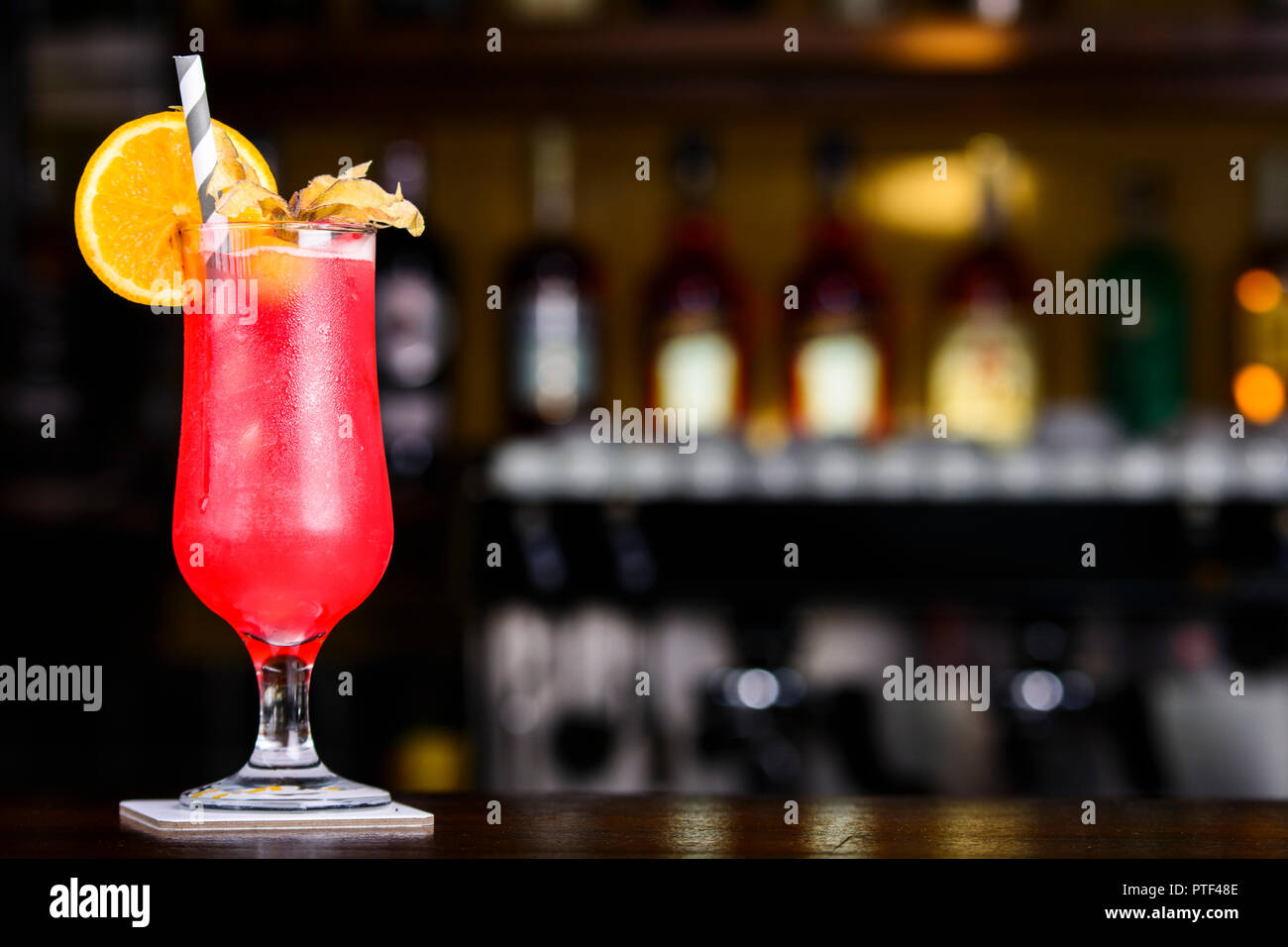 Strawberry Colada. Red decorated cocktail on the bar table. Stock Photo