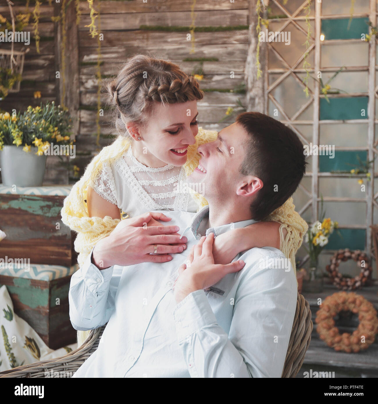 loving couple sitting in a stylish living room Stock Photo - Alamy