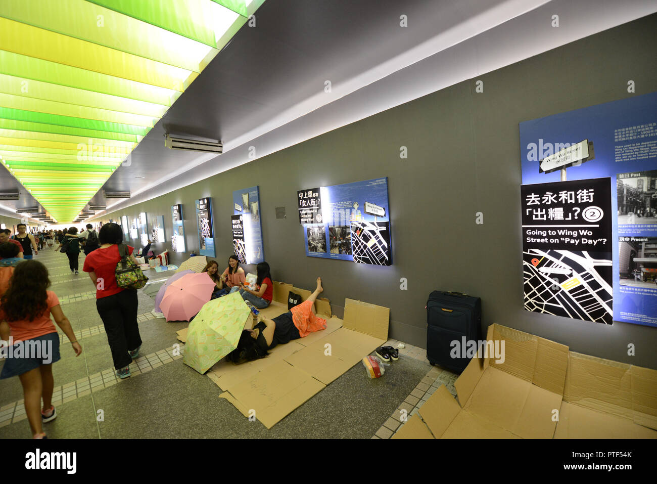 Filipino domestic helpers enjoying their Sunday ( day off ) in Hong Kong Central district. Stock Photo