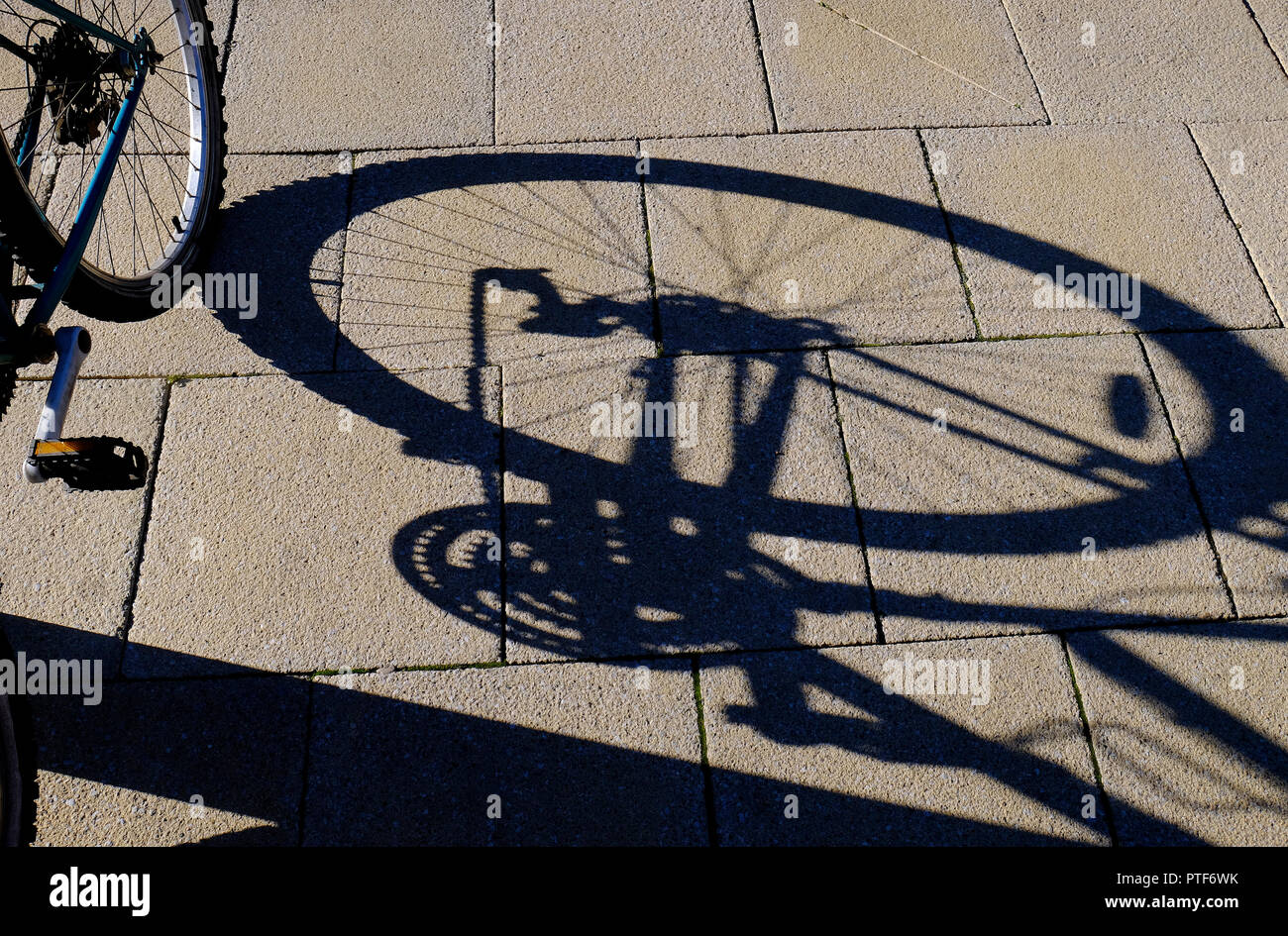 shadow of bike on pavement, cambridge, england Stock Photo