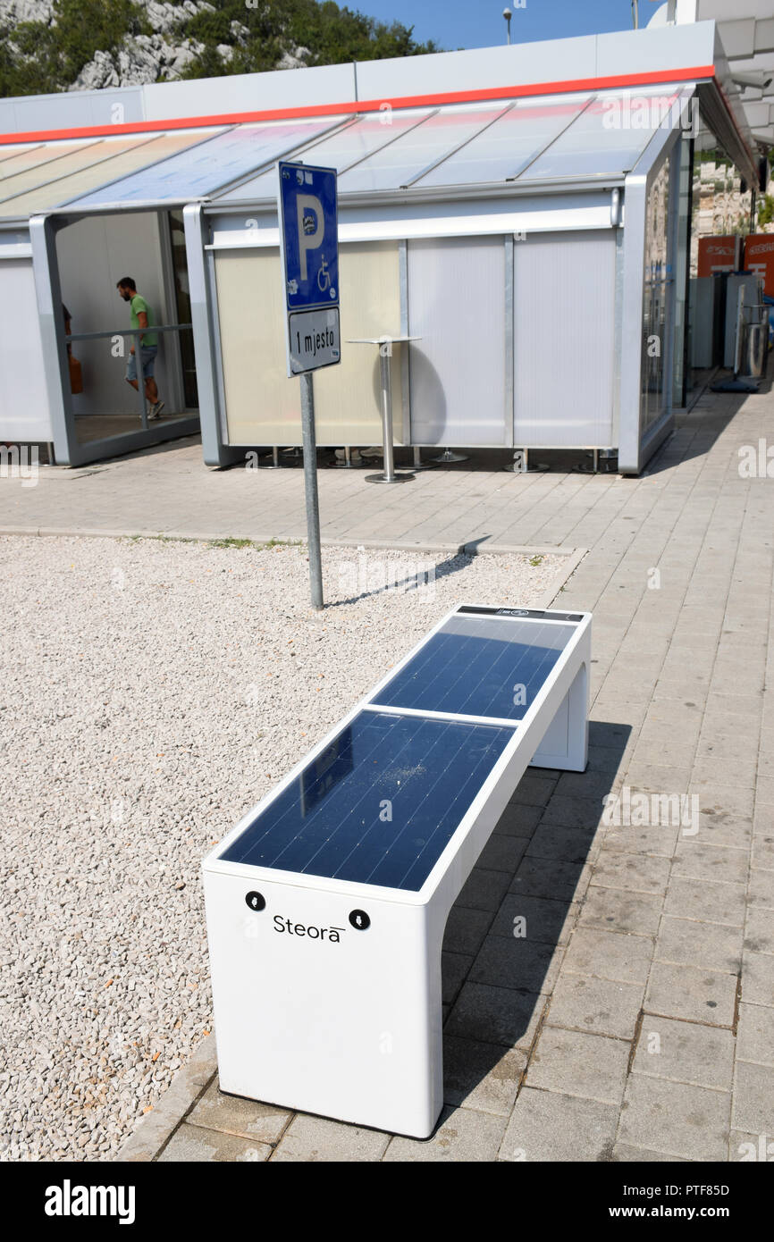 Steora smart bench, a solar powered street bench providing USB charging for mobile phones and other devices at motorway services, Croatia. Aug 2018 Stock Photo