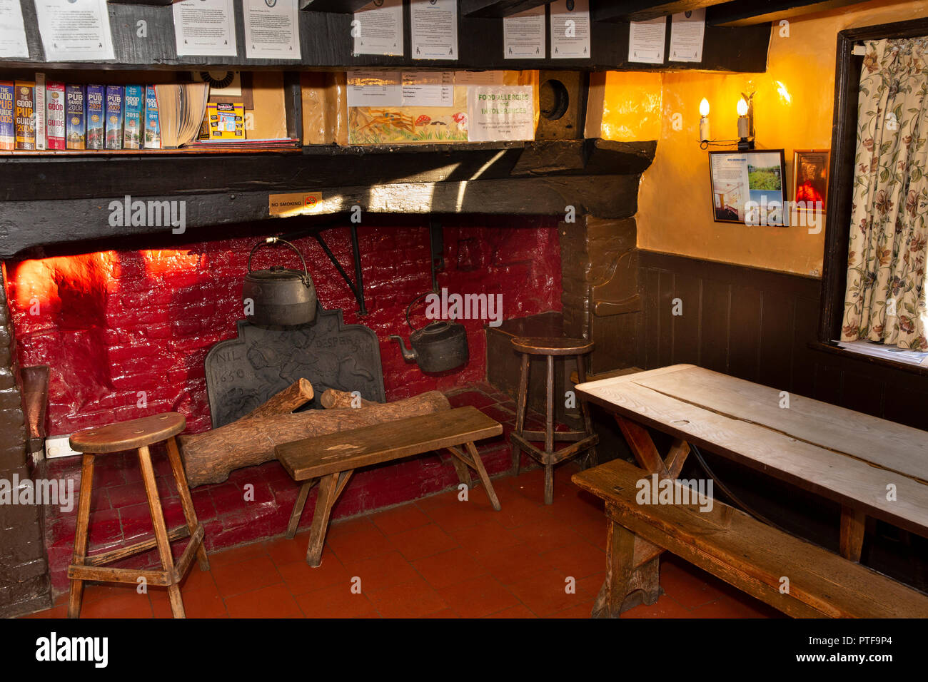 England, Berkshire, Aldworth,  Bell Inn, historic unchanged village pub, tap room interior, fireplace Stock Photo