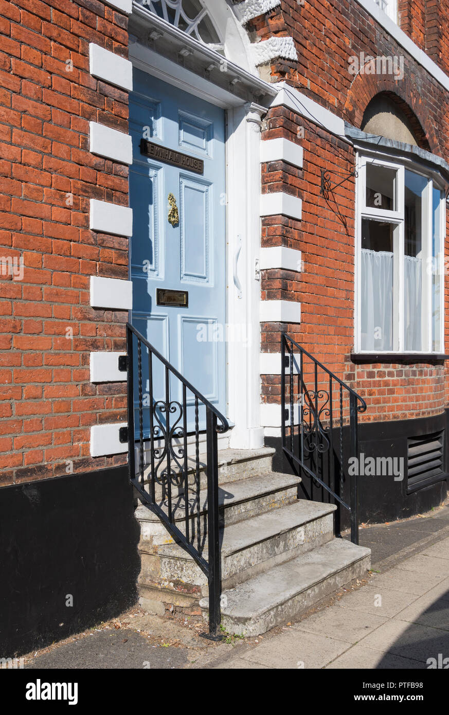 Steps from pavement to raised front door of Newnham House to prevent flooding, in Emsworth, Hampshire, England, UK. Stock Photo