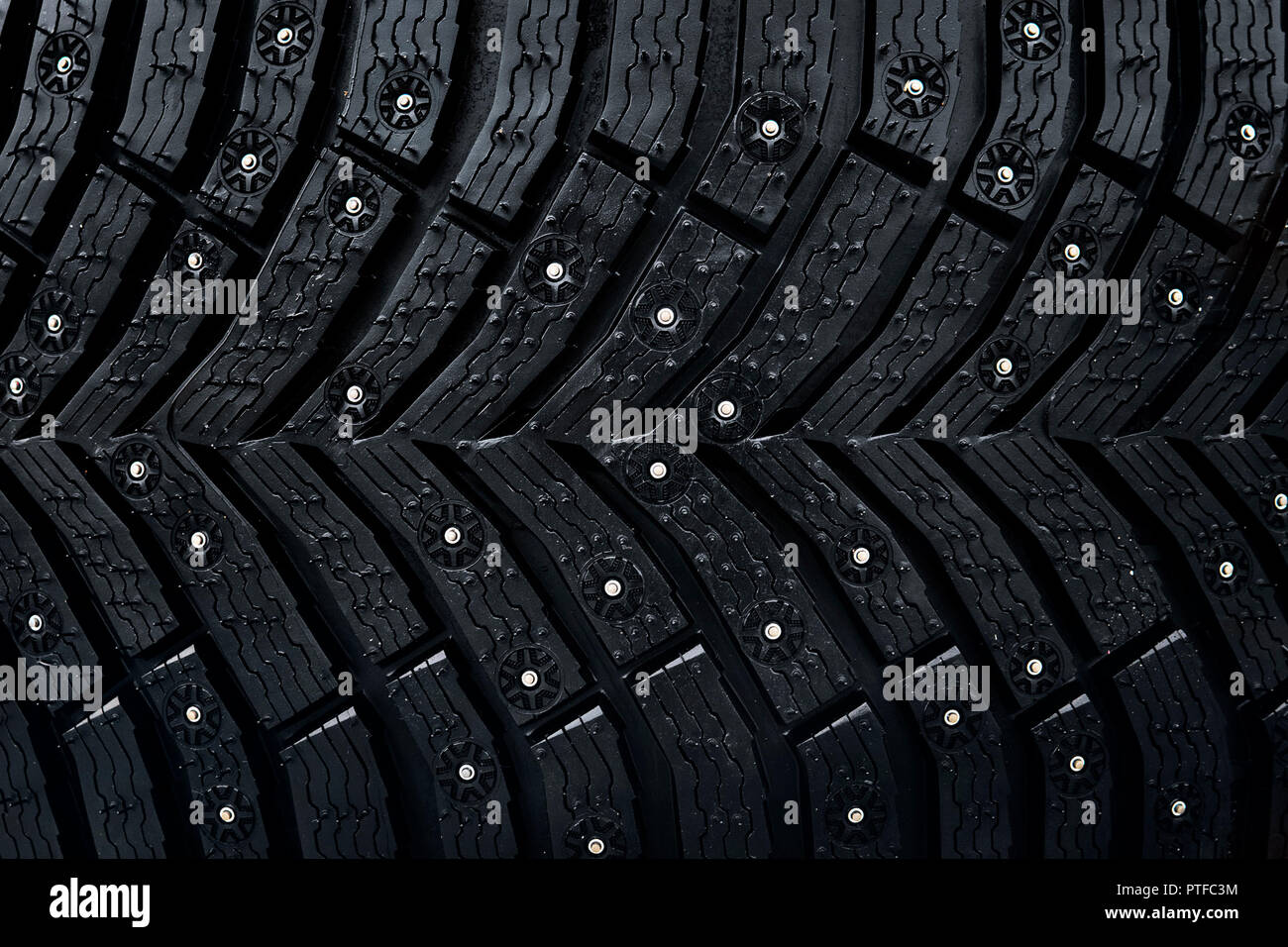 Wheel tire seamless pattern. A close up of a tire protector and studs. Winter tyre texture. Realistic illustration. Black rubber, studs and protector  Stock Photo