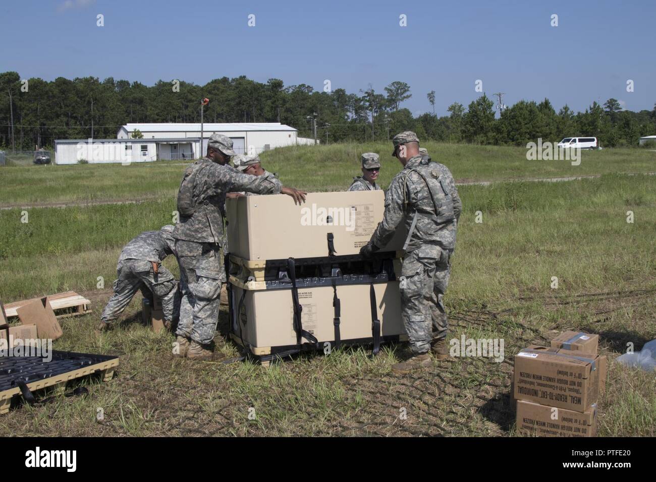 Soldiers with the 76th Infantry Brigade Combat Team, 38th Infantry Division, Indiana Army National Guard, prepare a package for sling load operations at Joint Readiness Training Center, Fort Polk, Louisiana, Thursday, July 20, 2017. Sling-load operations transports material or vehicles suspended under a helicopter. Stock Photo