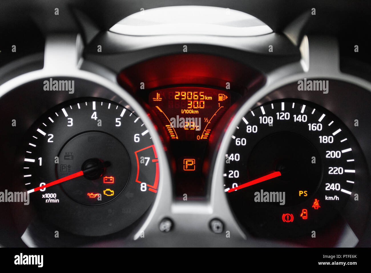 Dashboard close up, car interior, red light Stock Photo Alamy